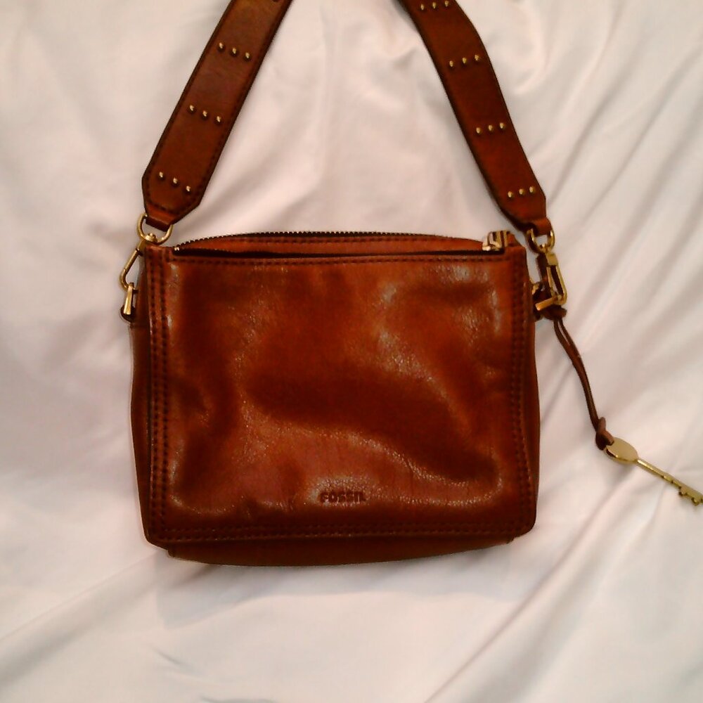 Small Fossil 3 Compartment Crossbody bag with a Studded Strap